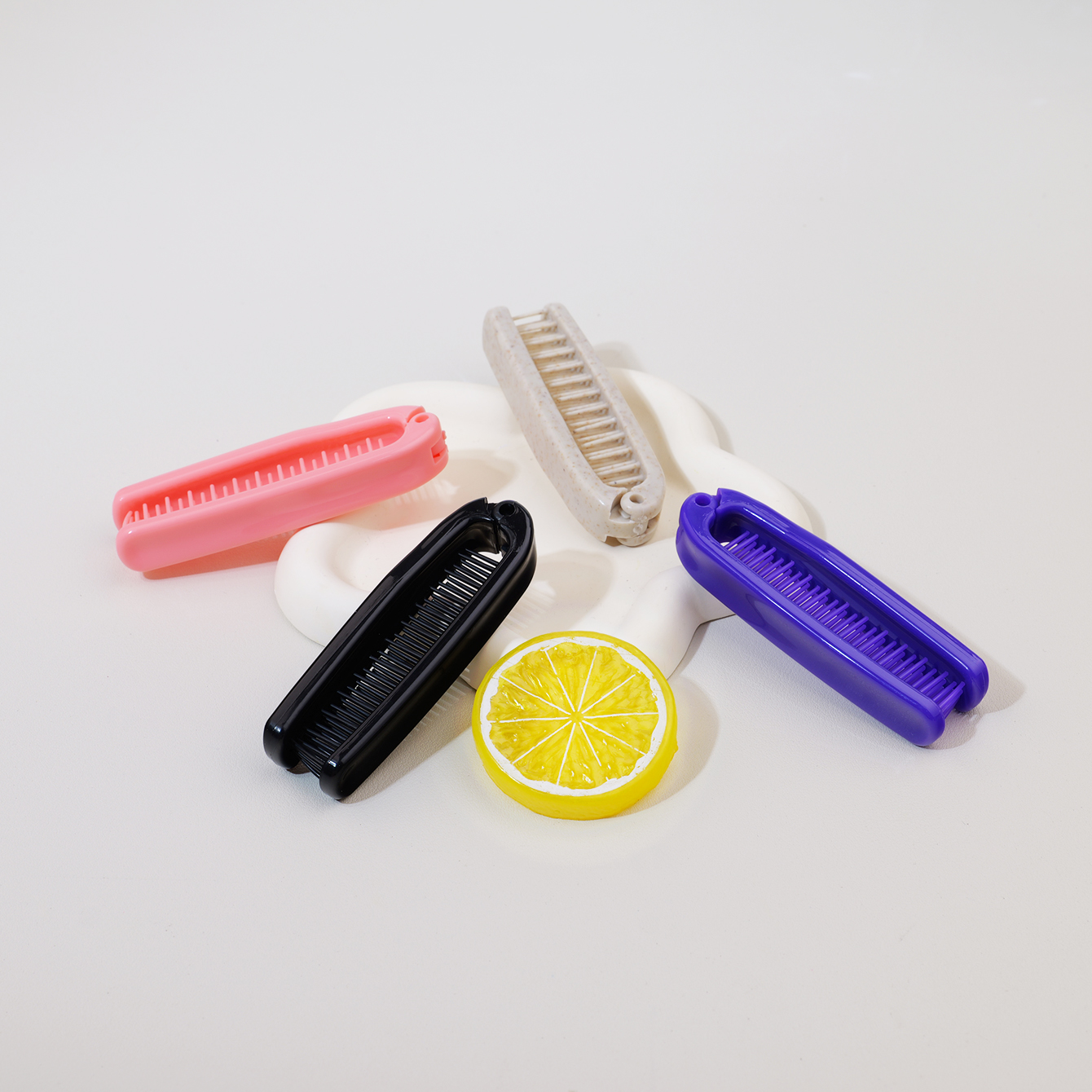 Comb Fine Tooth - A foldable portable plastic comb with
